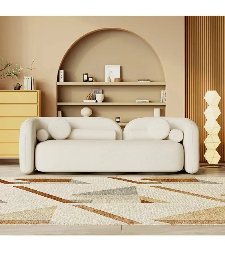 "Modern Curved Off-White Bouclé Sofa  with Round Accent Pillows"